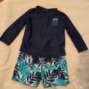 Toddler boy swim trunk and rash guard set.
